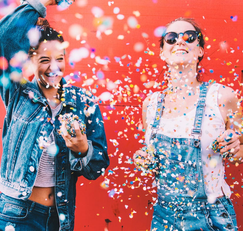 2 young women celebrating the Fourth of July, having the best July 4, 2021 per their zodiac signs.