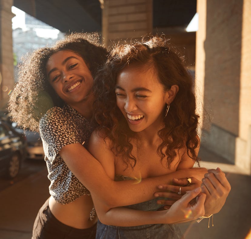 A pair of best friends hugging, per their zodiac signs.