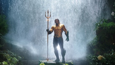 Jason Momoa gold suit and waterfall in Aquaman
