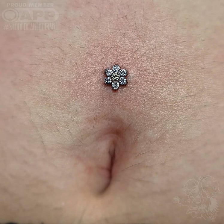 A dermal piercing done by Eden Cox.