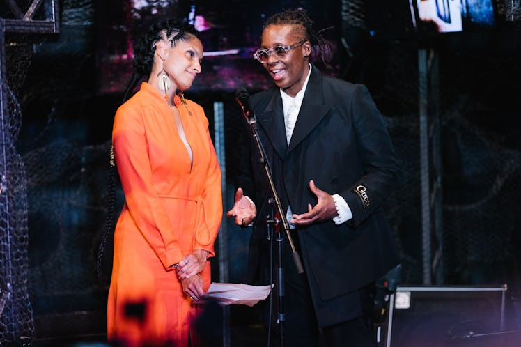 Racquel Chevremont and Mickalene Thomas next to a microphone