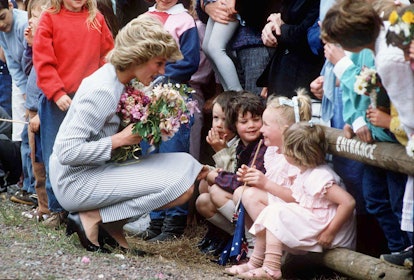 Diana, Princess of Wales receiving flowers from young children during a walkabout in Australia in 19...