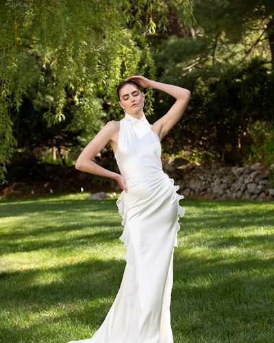 Young bride posing in a white Christian Siriano wedding dress