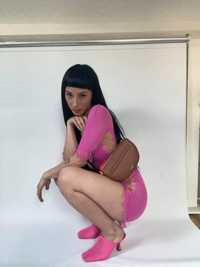 Creative director and co-founder of Trippin, Kesang posing in a pink Poster Girl dress and pink ASOS...