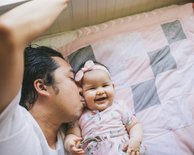 Dad kissing baby daughter on the cheek, best father's day shirts for the whole family