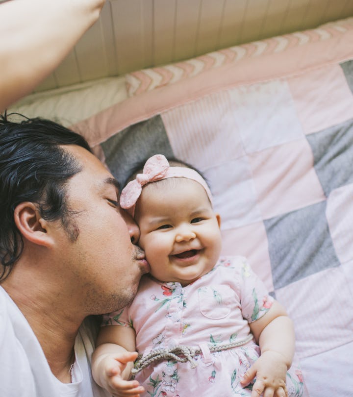 Dad kissing baby daughter on the cheek, best father's day shirts for the whole family