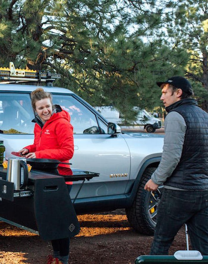 A Rivian R1T electric pickup truck with the Camp Kitchen accessory. EV. EVs. Electric cars. Automoti...