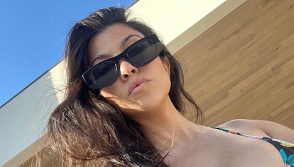 Kourtney Kardashian wears sunglasses in an Instagram post.