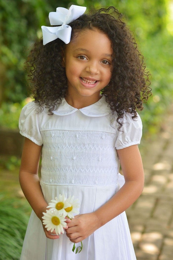 little girl in first communion dress