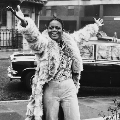 Portrait of Academy Award winning American actress Cicely Tyson smiling and raising her arms in the ...