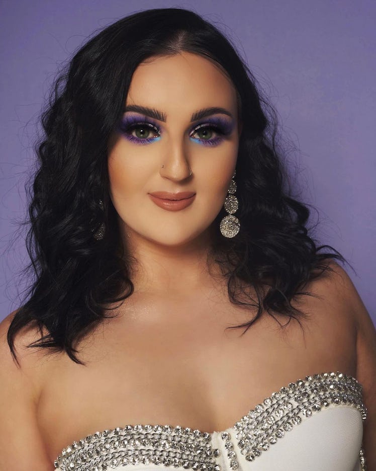 Mikayla Nogueira photographed in vibrant, blue eyeshadow and a full, glam face for her collection wi...