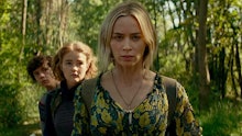 A scene from A Quiet Place, with Emily Blunt in the front, and her children in the movie, in the bac...