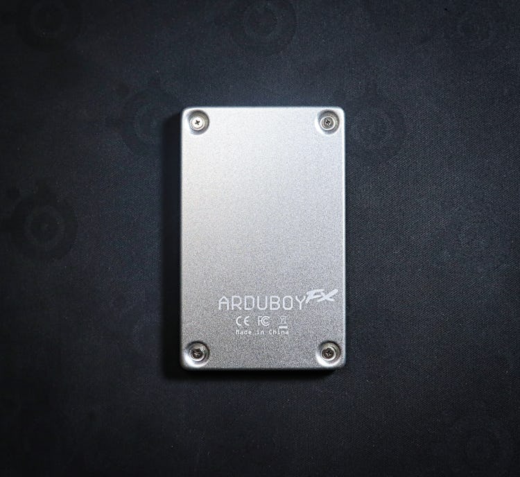 Pop off a few screws and you can easily get access to the Arduboy FX's guts. Go ahead and go nuts mo...