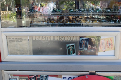 Newspaper clippings from different Marvel movies are Easter eggs on the Shawarma Palace cart in Disn...