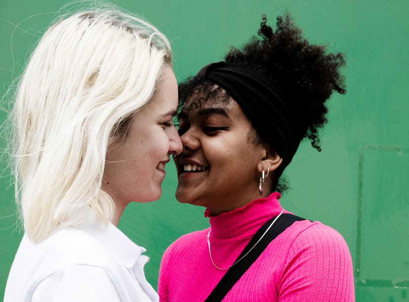 Young women close to kissing, learning how to get turned on via their Eros sign.