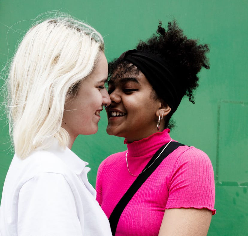 Young women close to kissing, learning how to get turned on via their Eros sign.