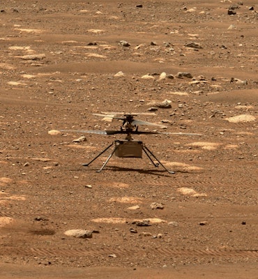NASA Ingenuity helicopter from afar on the surface off Mars.