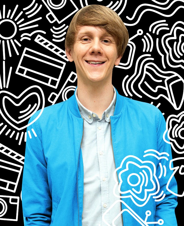 Josh Thomas in a light blue jacket and a white shirt