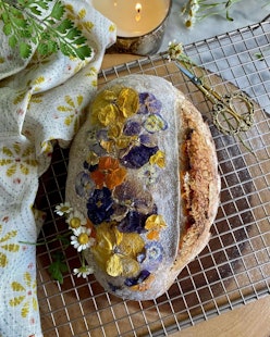 This bread loaf with edible flowers shows one of the biggest TikTok food trends.