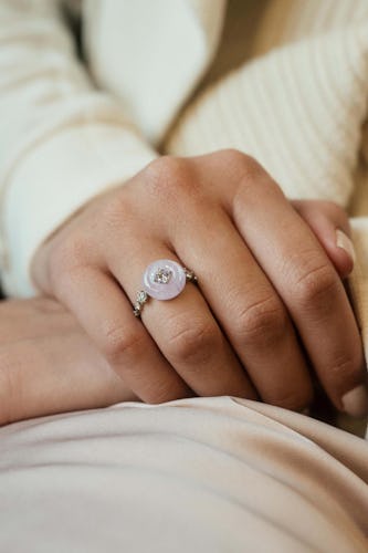 Model wears a moonstone engagement ring by Fernando Jorge.