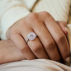 Model wears a moonstone engagement ring by Fernando Jorge.