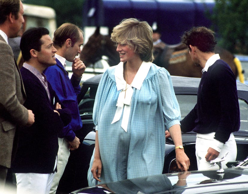 A pregnant Princess Diana wearing a blue sailor dress
