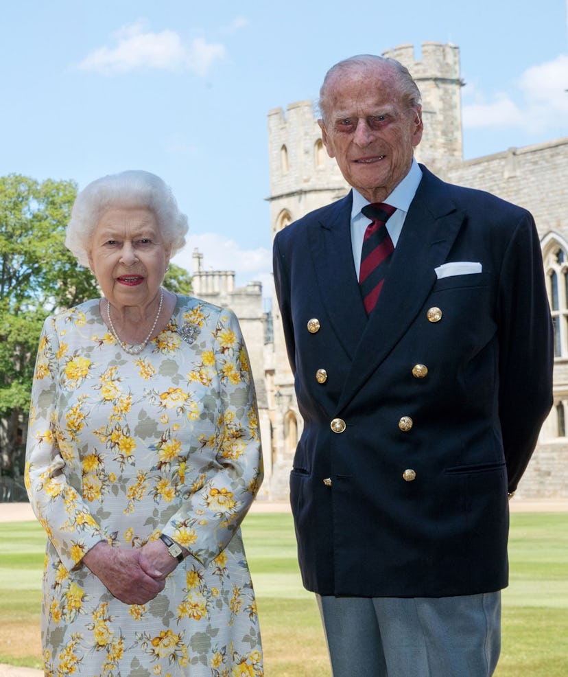 Queen Elizabeth II and the Duke of Edinburgh pose in the quadrangle of Windsor Castle ahead of his 9...