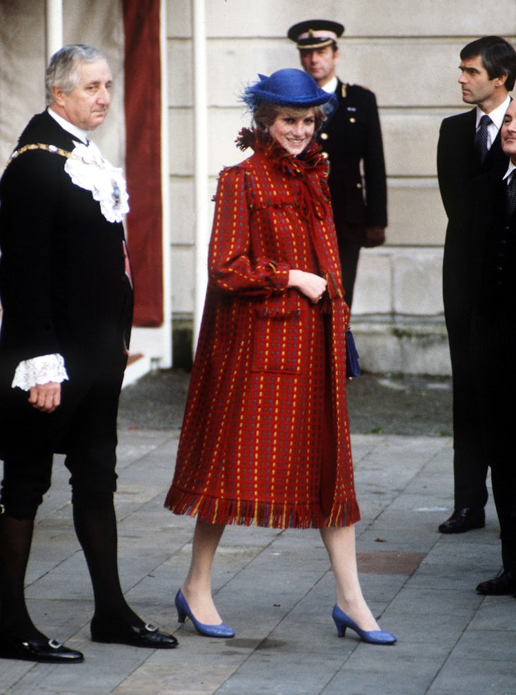 Princess Diana wearing a red coat