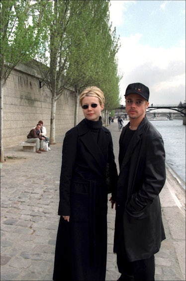 Gwyneth Paltrow and Brad Pitt wearing all black and holding hands in Paris