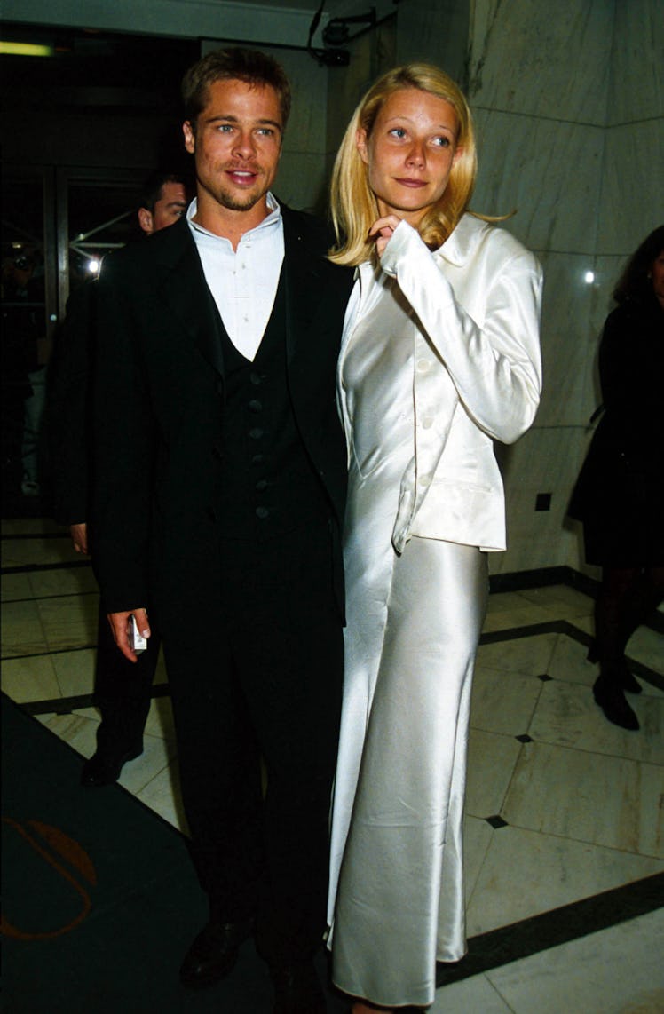 Brad Pitt standing with Gwyneth Paltrow dressed up at the 'Legends Of The Fall' U.K. Premiere