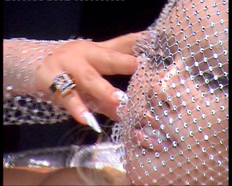 Shygirl wearing a Burberry white netted top and a net with diamonds covering her face