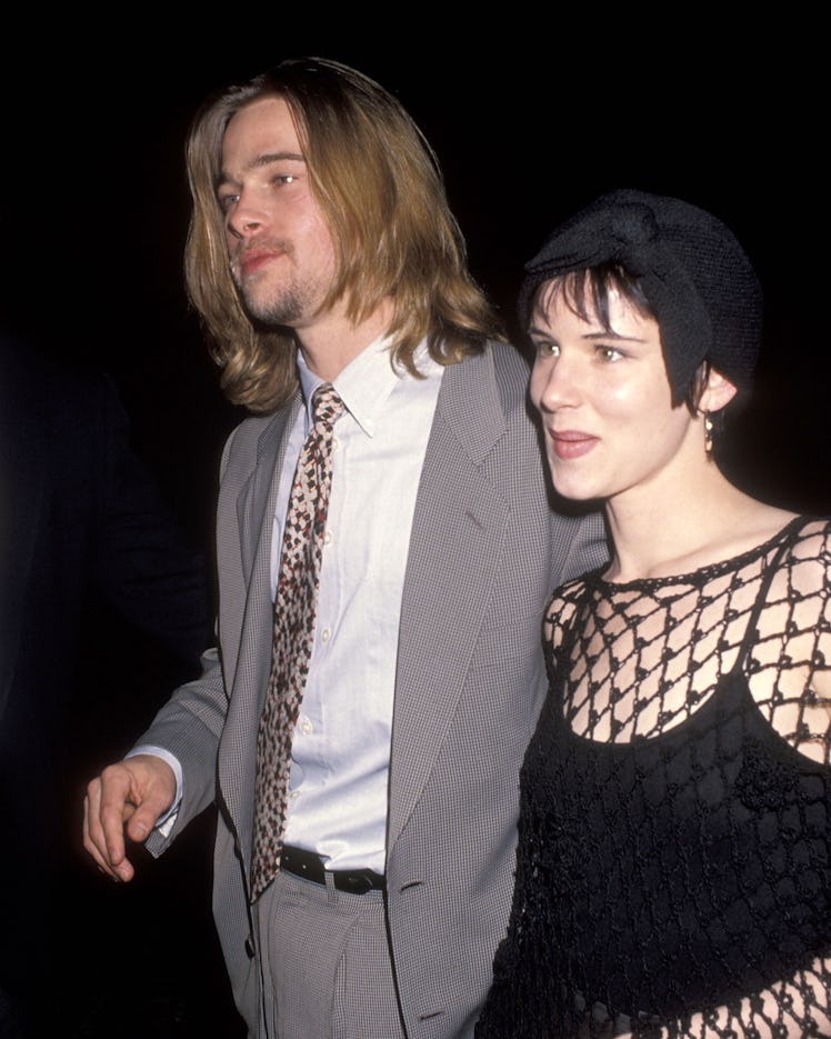 Juliette Lewis walking along with Brad Pitt at the 1993 NATO/ShoWest Convention