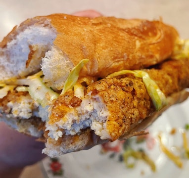 A breaded and fried tofu sandwich.