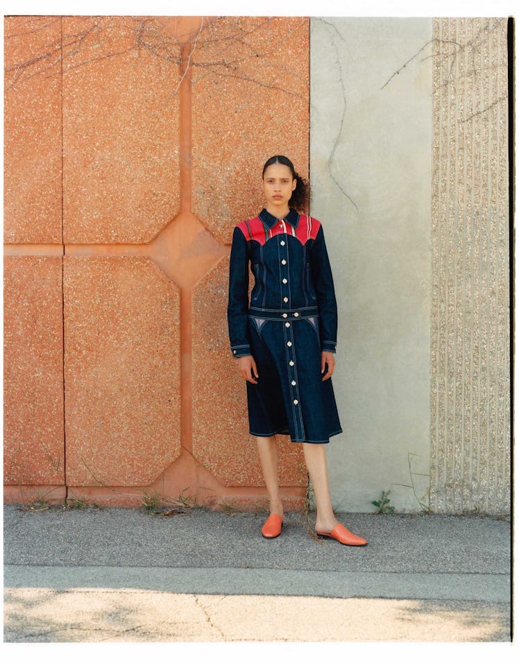 A female model posing in a Texas denim dress