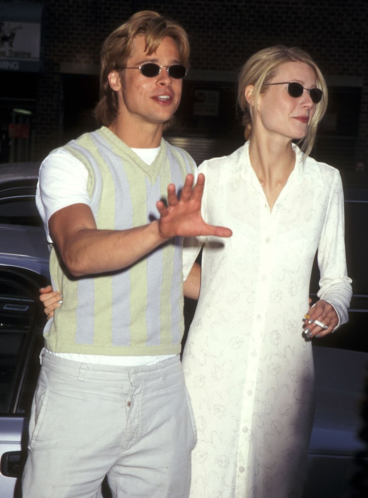 Brad Pitt and Gwyneth Paltrow walking and hugging each other