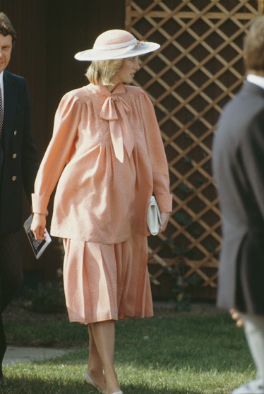 Princess Diana wearing a salmon two-piece