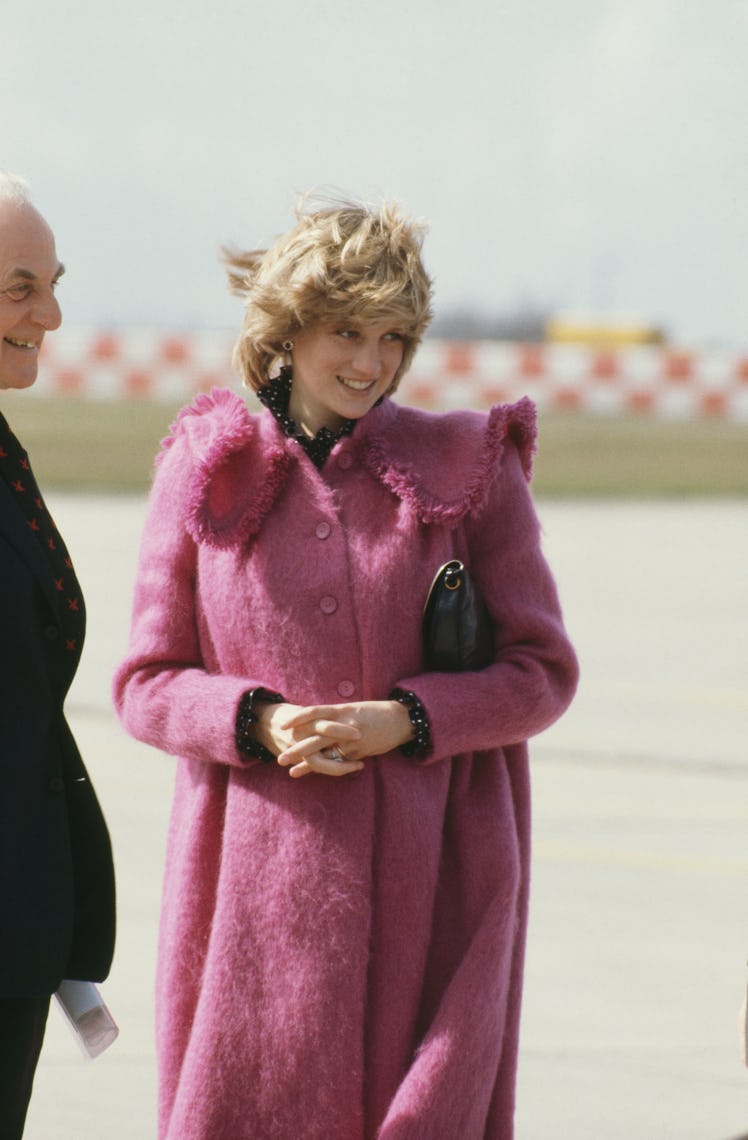 Princess Diana wearing a pink fuzzy coat
