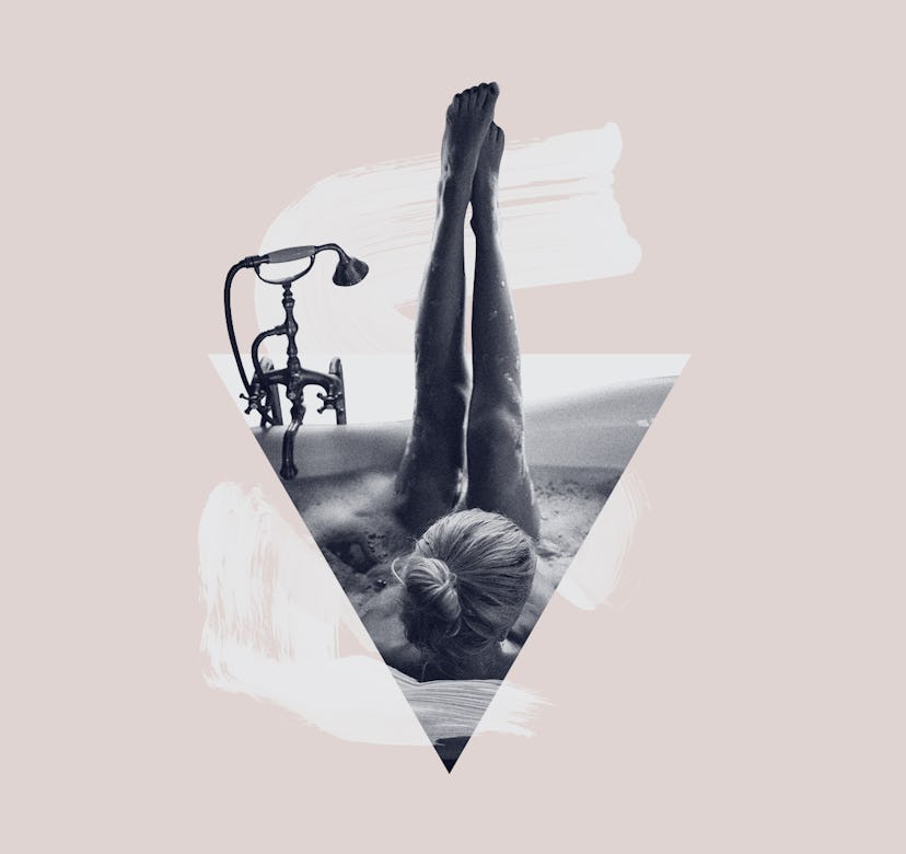 Woman in a bathtub having female personal care time