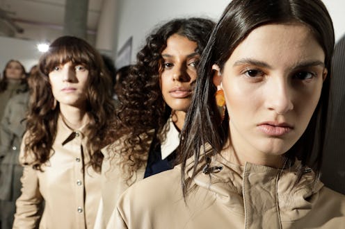 models backstage at fashion week
