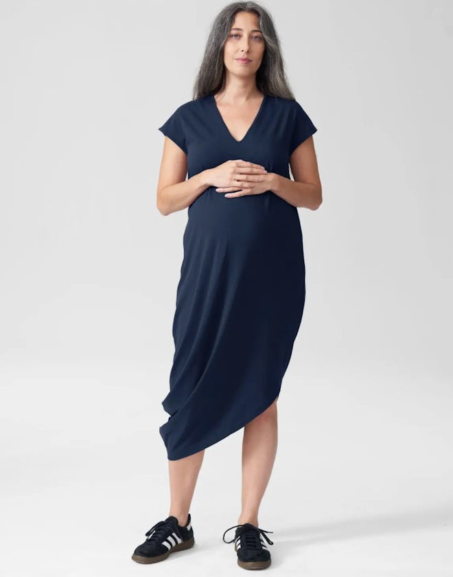 soft navy maternity dress with cap sleeves and an asymmetrical hem