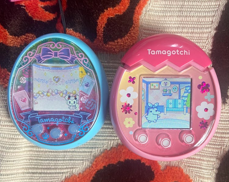 Blue Tamagotchi On Wonder Garden is shown next to pink Tamagotchi Pix