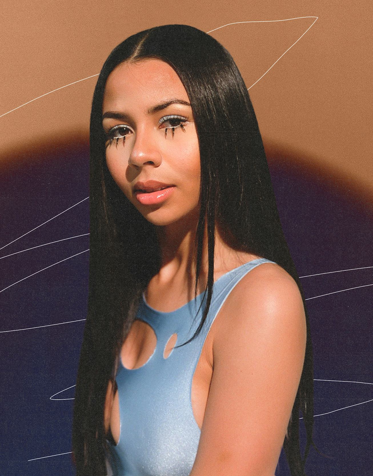 The Atlanta R&B vocalist’s Mariah The Scientist in an open blue dress combined with same shade makeu...