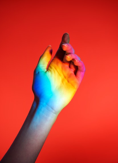 Hand with rainbow colors in need of a quote, caption, or pun for Instagram.