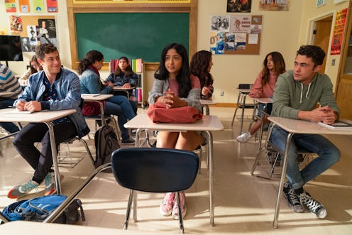 Devi sitting between Paxton and Ben in a classroom at three desks.