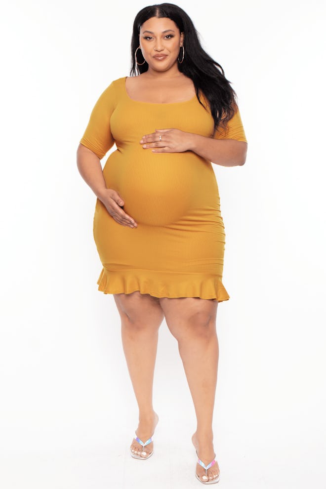 a mustard yellow maternity midi dress with ruffle hem 
