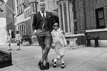 Alan Kim in Thom Browne's latest campaign dressed as an adult standing next to Thom Browne