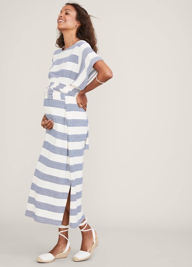 a white and gray ankle length wrap dress with boxy top and side slits