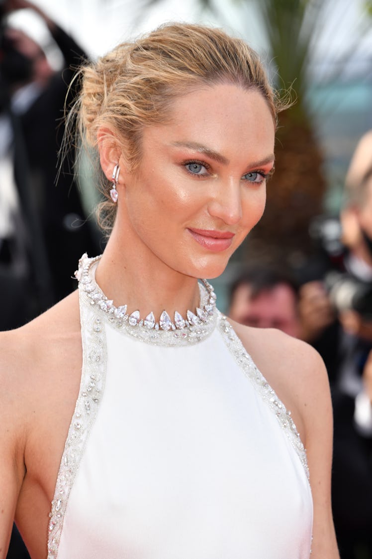 Candice Swanepoel in a white dress and a crystal choker necklace at the Cannes Film Festival 2021