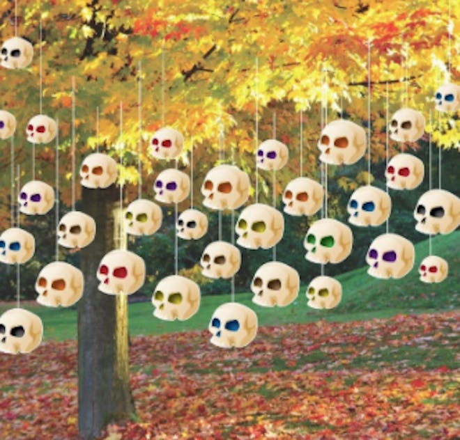 Decorative skulls hanging from a tree