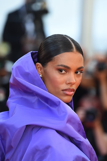 Tina Kunakey in a purple hooded dress at the Cannes Film Festival 2021